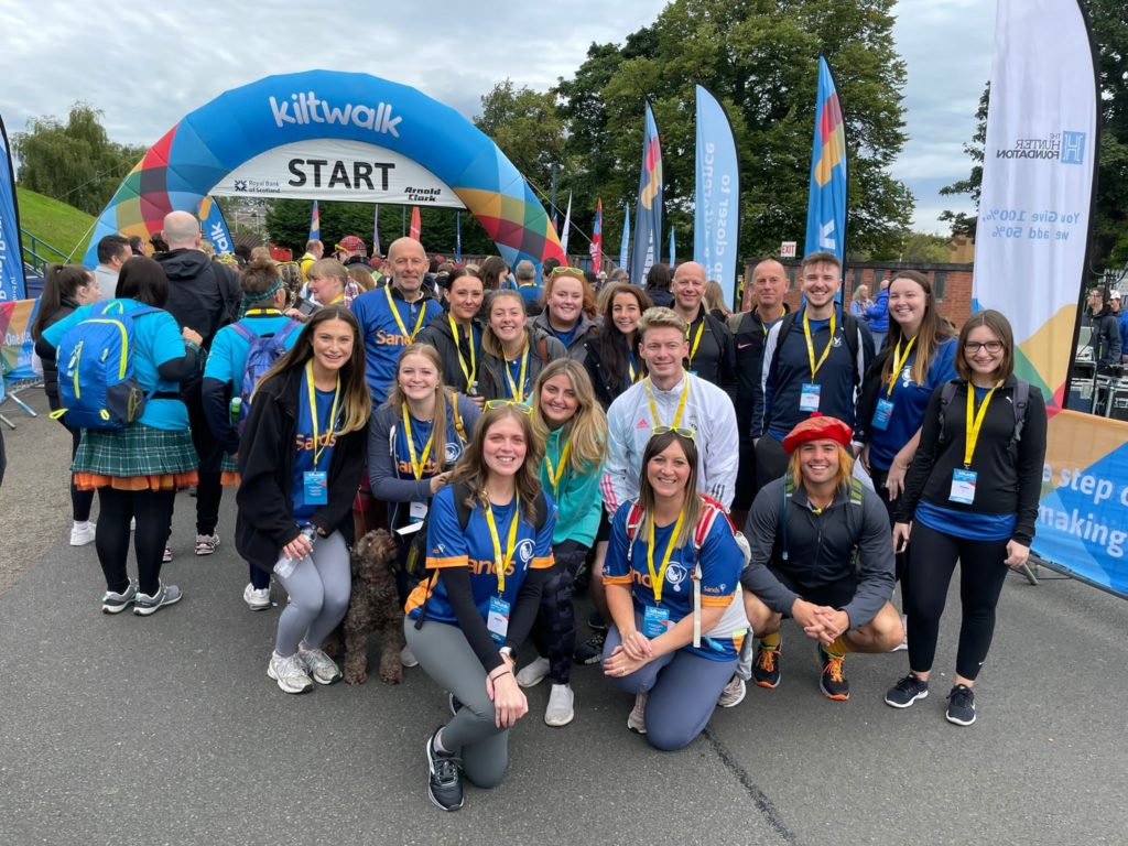 Group picture of participants in the Kiltwalk 2022 at the start line